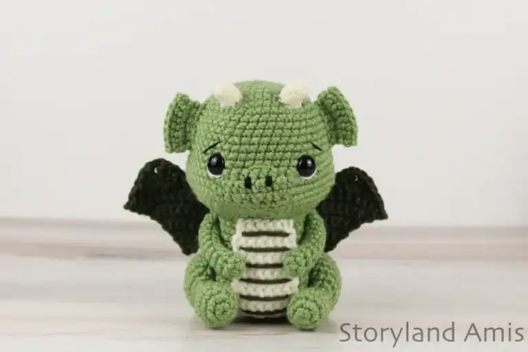 A green amigurumi dragon.