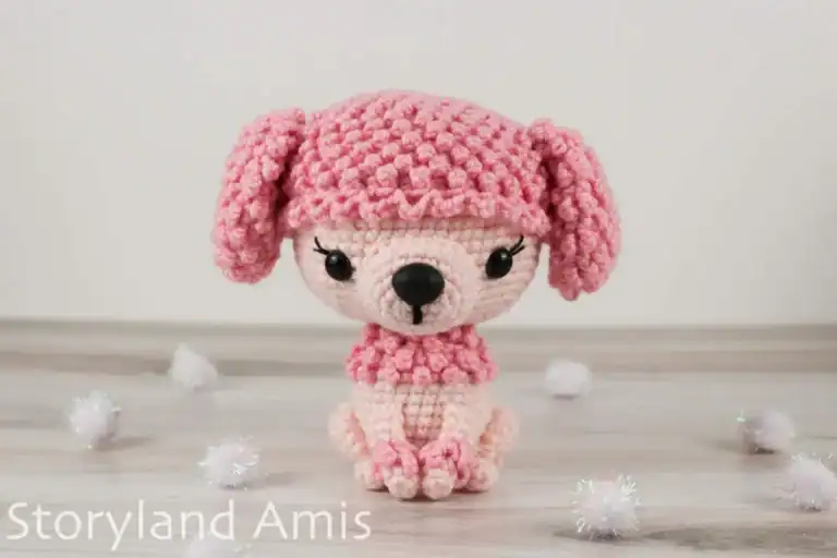 A pink amigurumi Poodle dog.