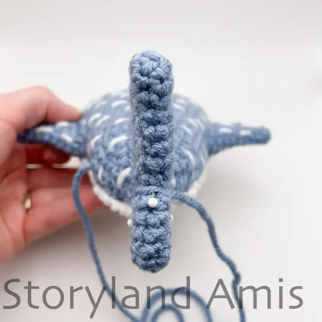 The backside of a crocheted whale shark is shown.