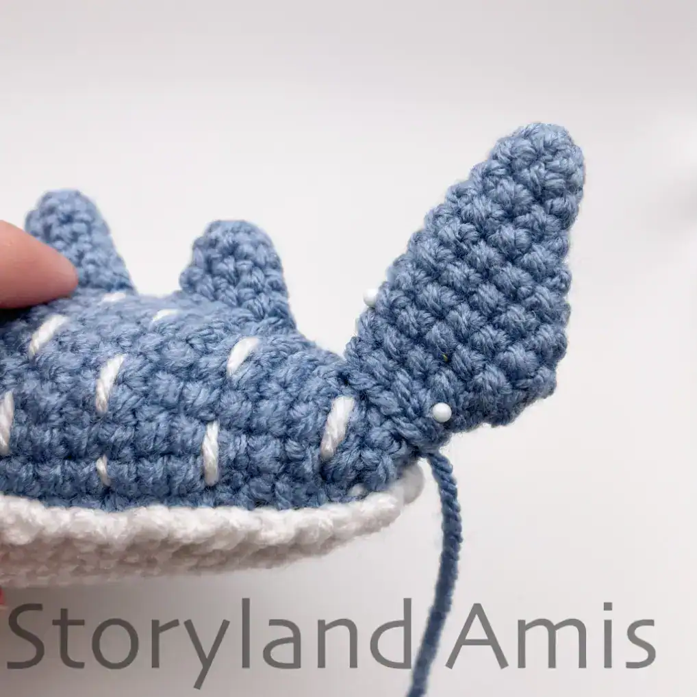 The tail fin on a crocheted whale shark..