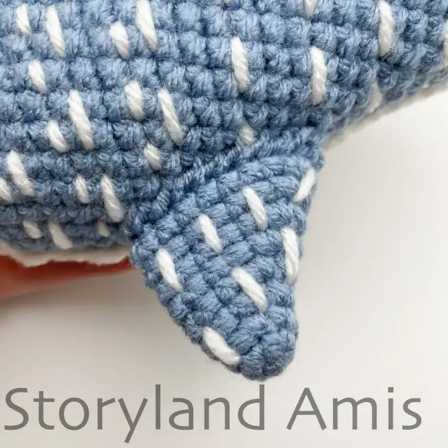 A crocheted whale shark fin.