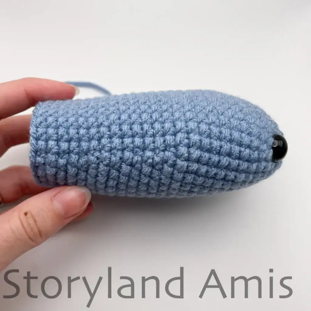 A partially finished amigurumi whale shark shown from the side.