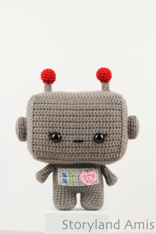 A crocheted amigurumi robot.