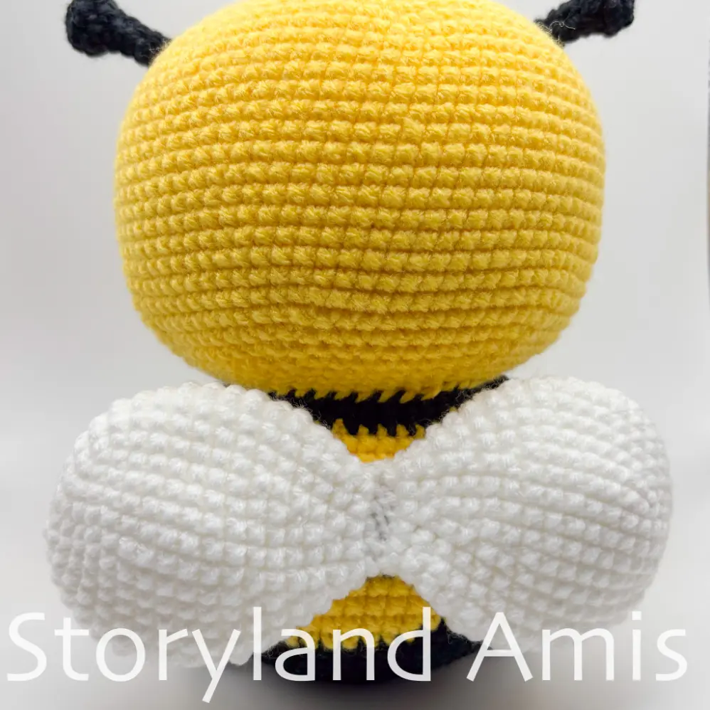 The back side of an amigurumi bee.