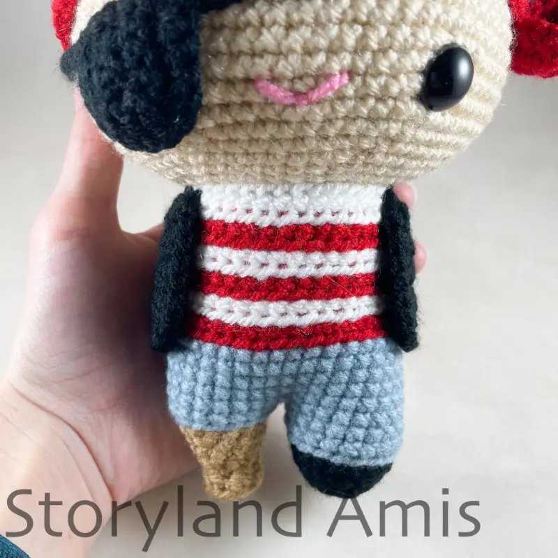 A close-up of an amigurumi pirate doll's body.