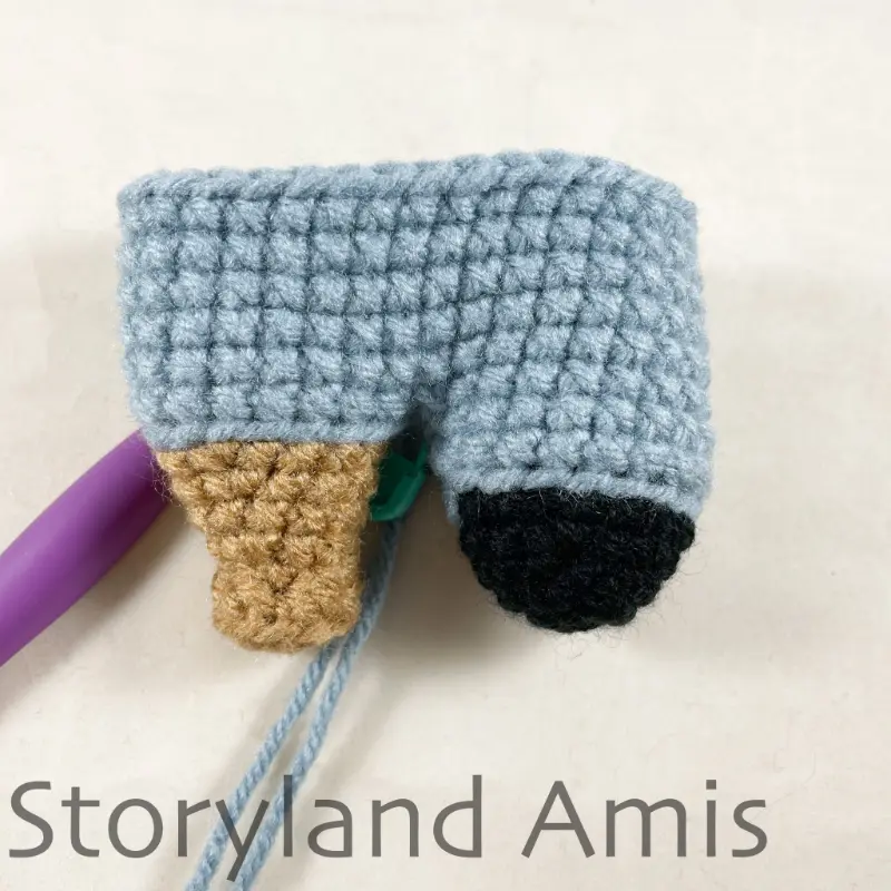 A partially finished amigurumi pirate doll's body.