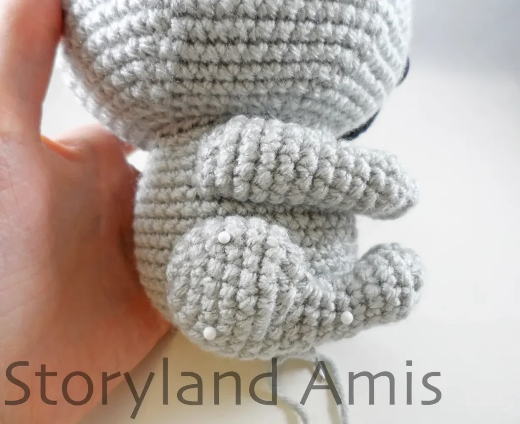 A close-up of the back of an amigurumi koala's body.