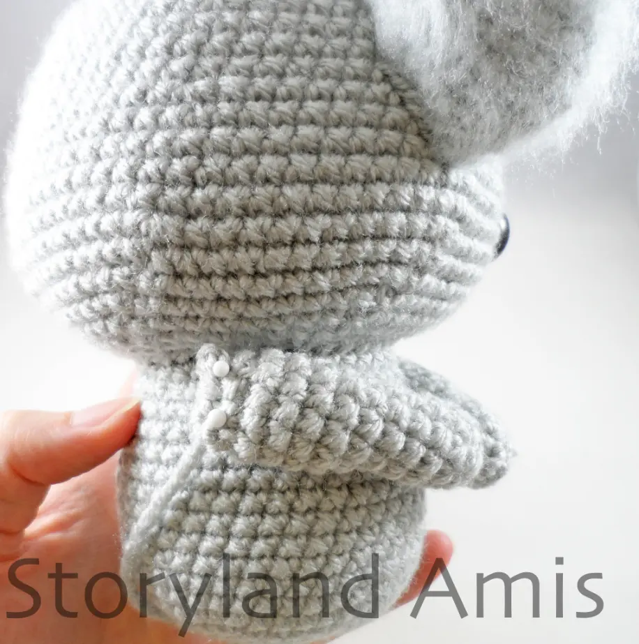 A close-up of the back of a work-in-progress amigurumi koala.