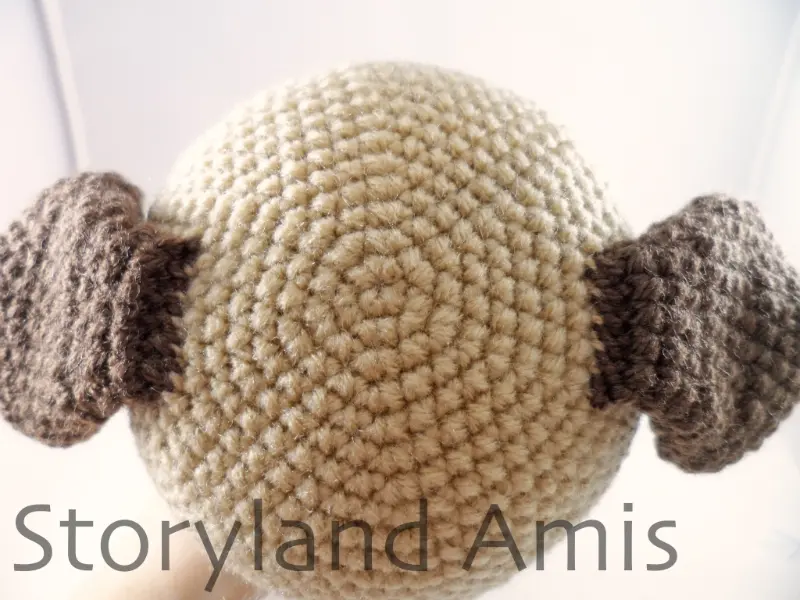 A close-up of the top of the head of an amigurumi dog.