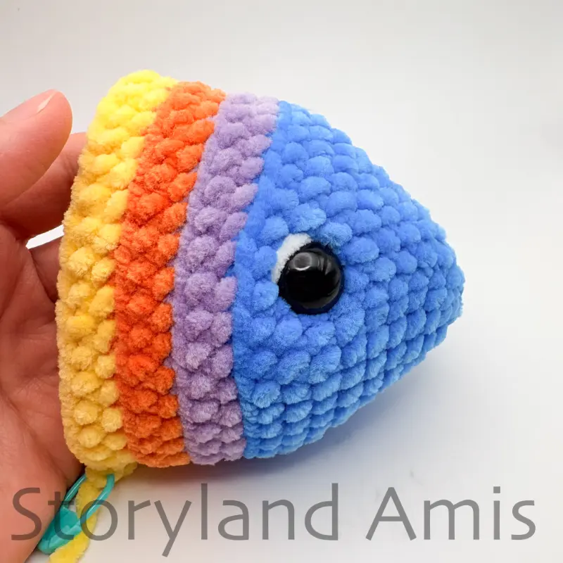 A partially finished crocheted amigurumi fish.