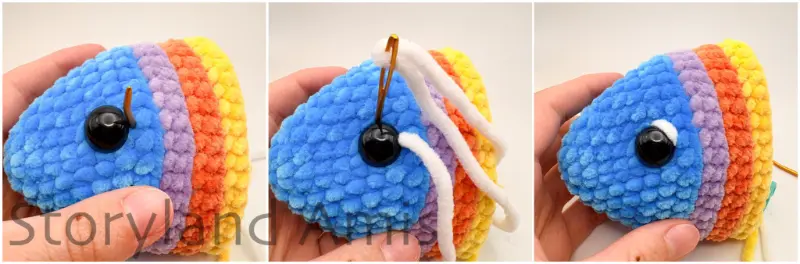 A three-panel image shows the step-by-step process of a hand using a tapestry needle to add a white stitch to the edge of a safety eye on an amigurumi fish.