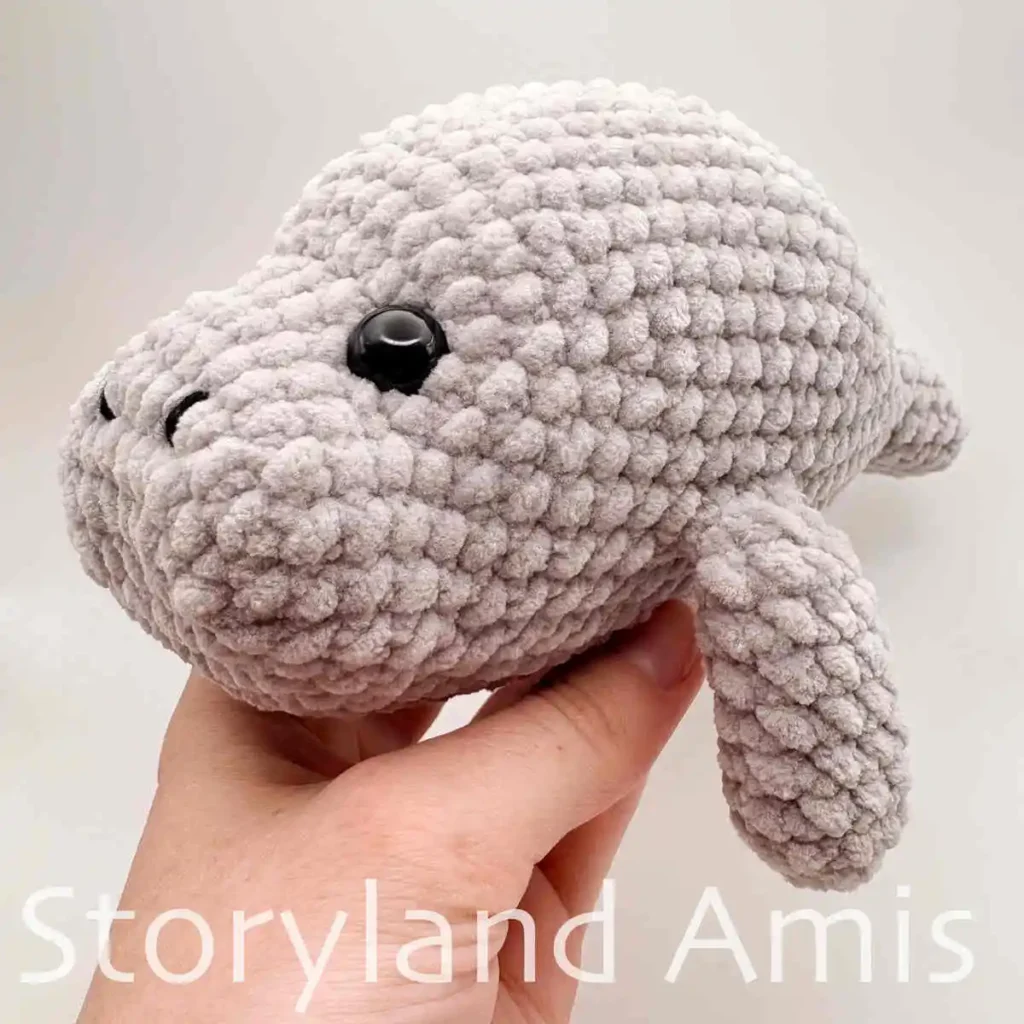 A close-up of the side of an amigurumi manatee's face.